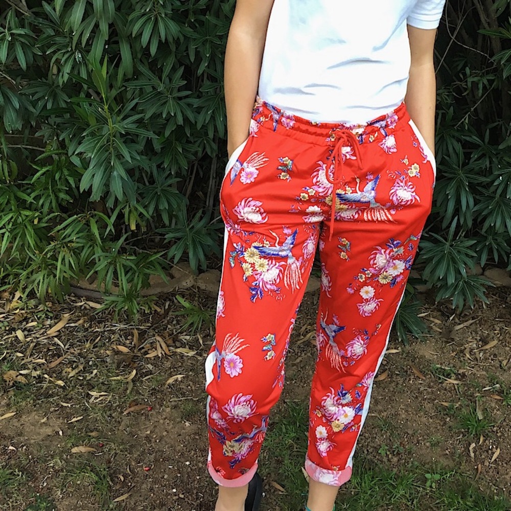 Red tracksuit pants with lining and bright print